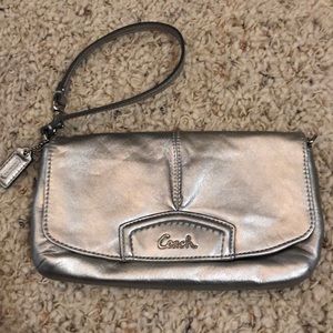 Coach wristlet/clutch and dust bag.